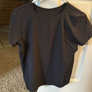 Lululemon short sleeved running top, light weight and reflective.  Size 6.